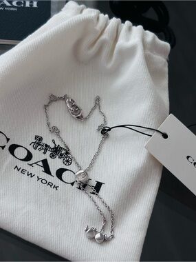 COACH Silver Signature Pave Crystal Slider Bolo Bracelet